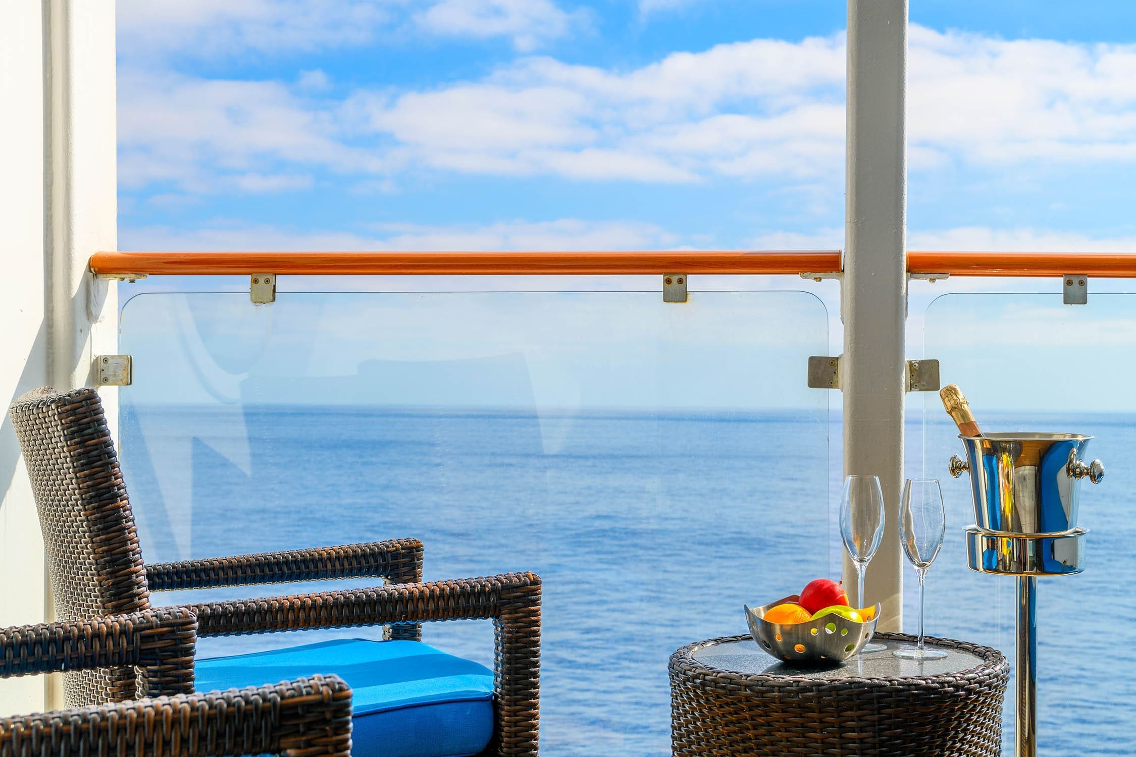 Using a modern hotel room image with a balcony overlooking a stunning turquoise ocean are a great way to improve your hospitality SEO tactics.